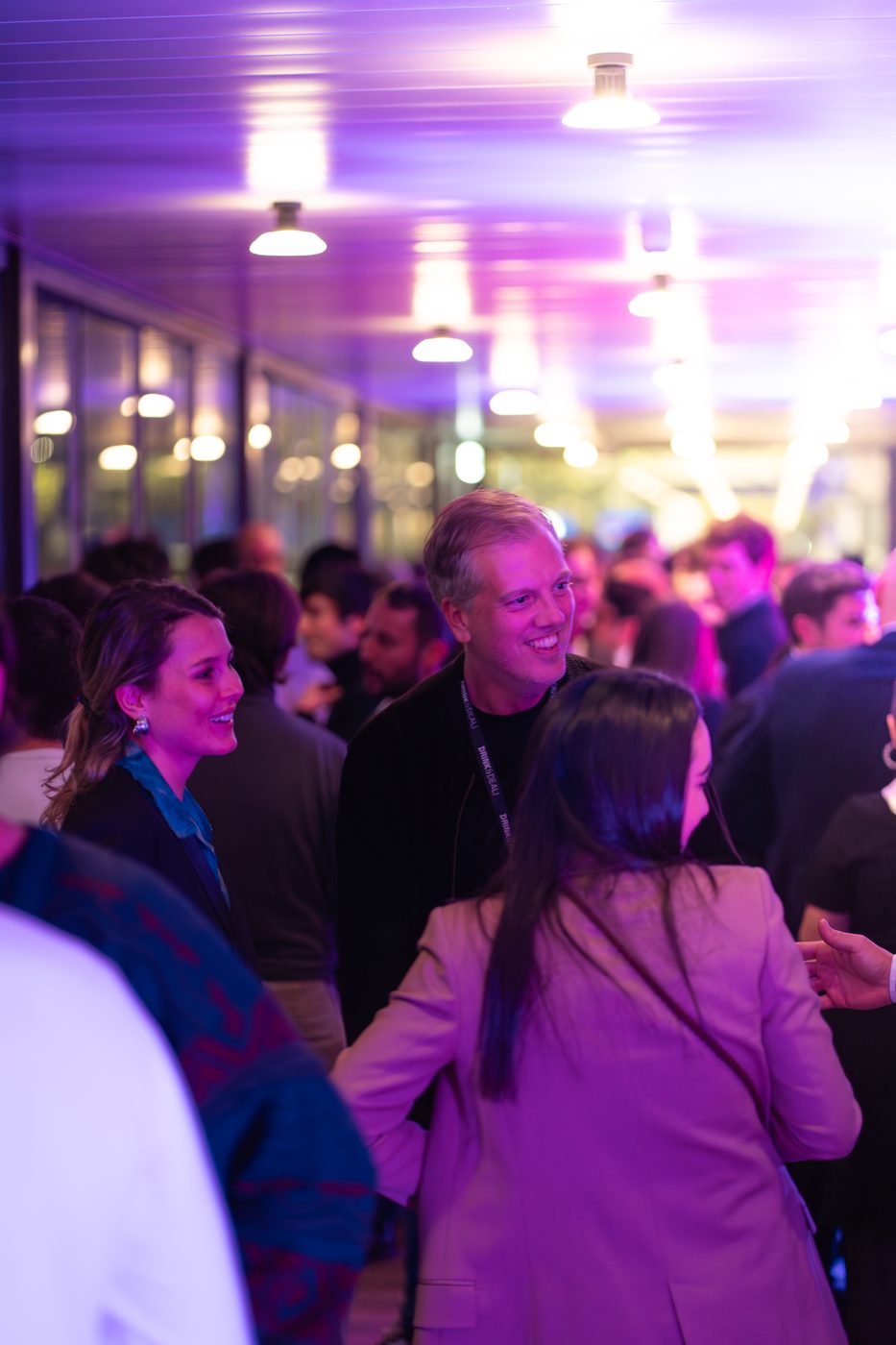 Guests laughing with drinks