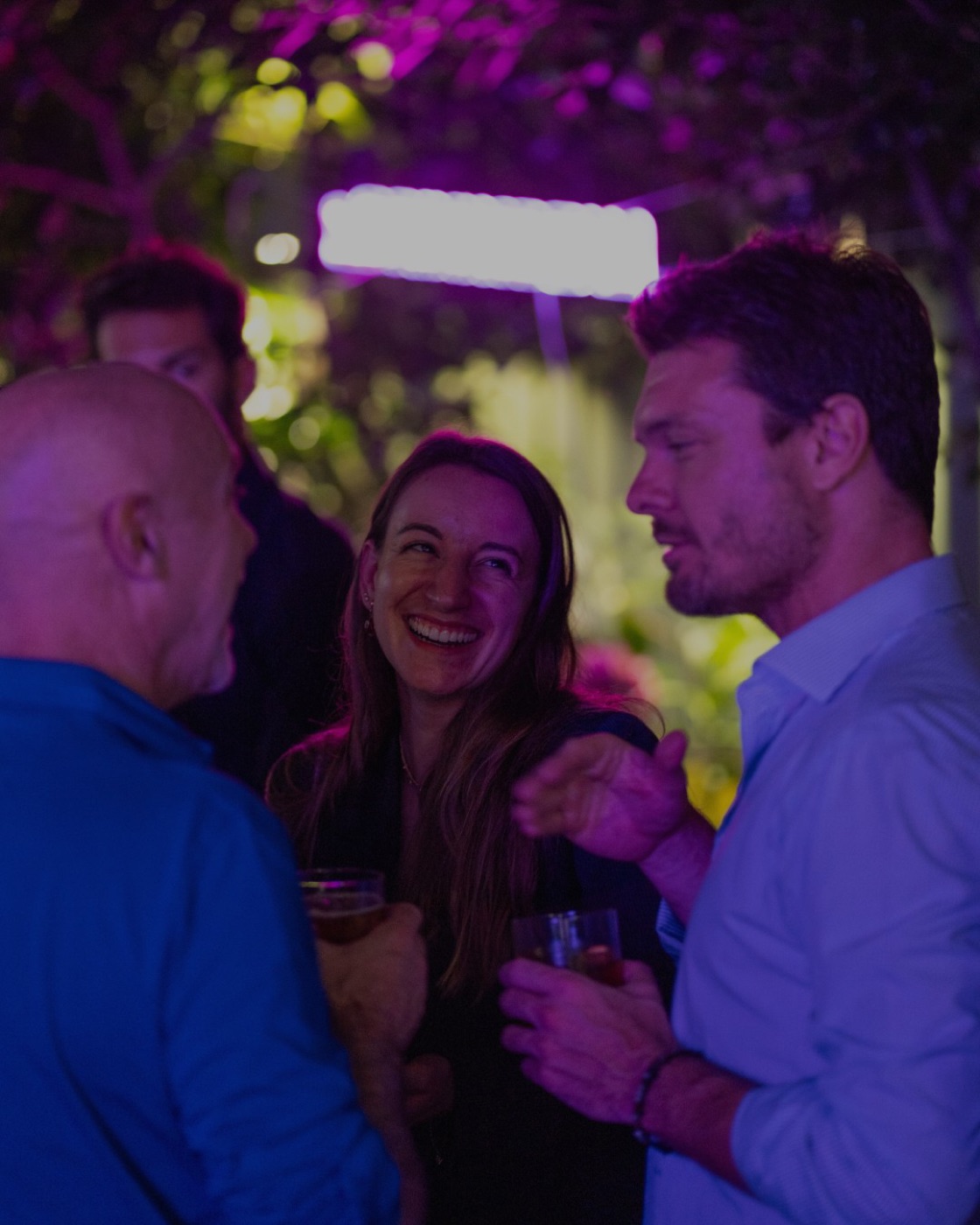 Guests laughing in the garden